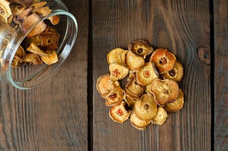 Dried pears from glass can on wooden background. Top view.の写真素材