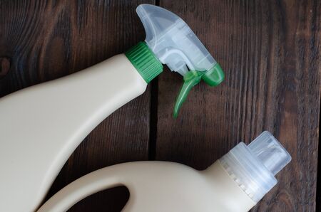 Detergent solutions on wooden background with copy space. Cleansing spray.の写真素材