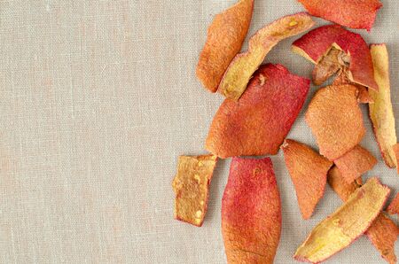 Pomegranate-peel on linen with copy space. Top viewの写真素材