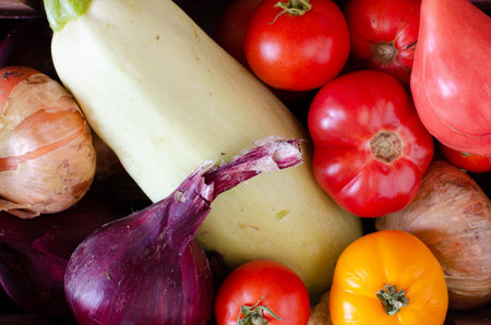 vegetables background. Tomatoes, onions, marrow. Top viewの写真素材