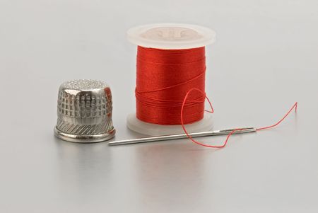 Sewing kit isolated on gray background 