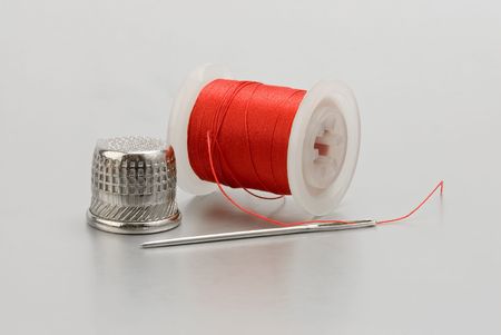 Sewing kit isolated on gray background 