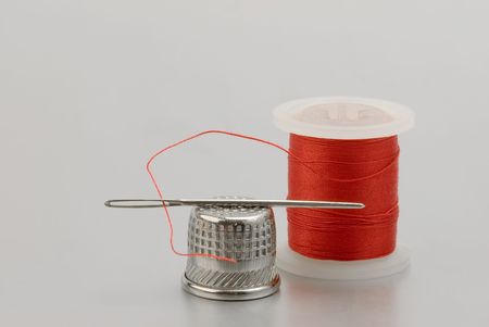Sewing kit isolated on gray background の写真素材