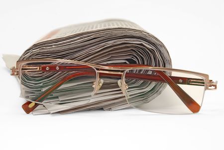 old newspapers and glassesの写真素材