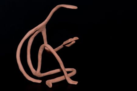 Raw sculpture from polymer clay of reading person. Handmade by author of pictureの写真素材