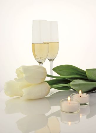  Glasses of champagne, flowers and candlesの写真素材