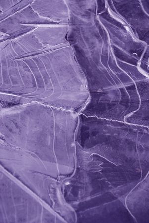 Close up: ice frozen water natural background purple coloredの写真素材