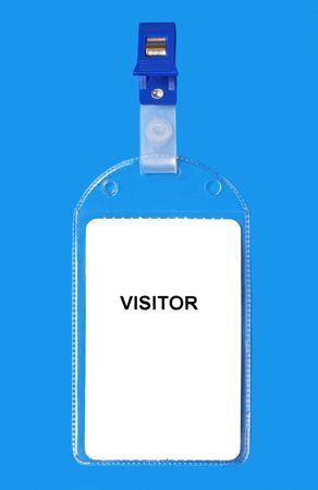 Visitor badge ID isolated on blue backgroundの写真素材