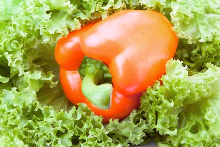 Fresh vitamin background. Close up orange pepper and saladの写真素材