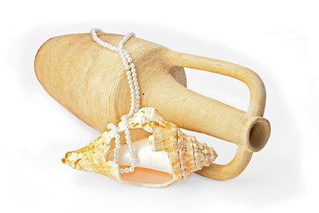 Ancient amphora, tropical sea shell and pearls over whiteの写真素材