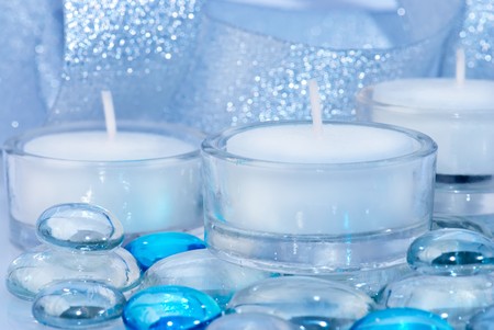 Decoration with candles, glass drops and shining ribbon. Blue tinted. SDOFの写真素材