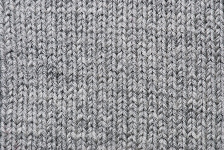 Grey knitting background of handmade woolen patternの写真素材