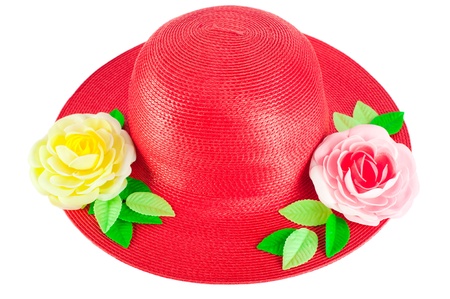 Red straw woman`s summer hat with roses isolated on white backgroundの写真素材