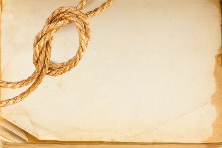 Old book page and hemp rope with space for your textの写真素材