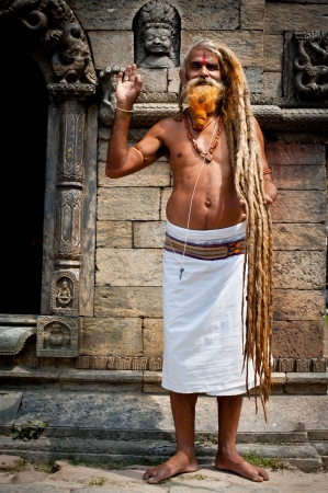 KATHMANDU, NEPAL, PASHUPATINATH TEMPLE - SEPTEMBER 21: Holy Sadhu man with dreadlocks and traditional painted face at Pashupatinath Temple. Nepal, Kathmandu. September 21, 2012のeditorial素材