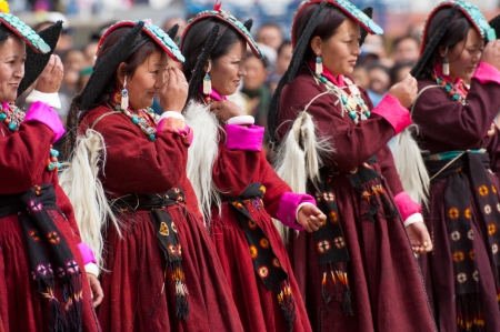 LEH, INDIA - SEPTEMBER 08, 2012: Women in traditional Tibetan clothes performing folk dance.  Annual...