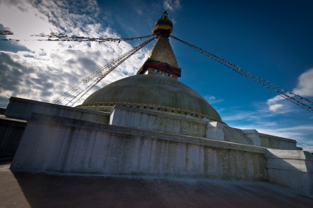 Buddhist Shrine Boudhanath Stupa with pray flags over sunset sky. Nepal, Kathmanduの写真素材