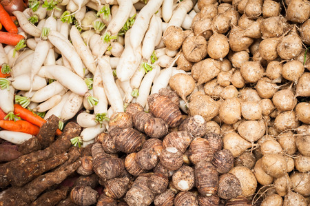Fresh organic vegetables and fruits at asian food marketの写真素材