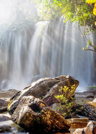 Sunny day at tropical rain forest landscape with flowing water of Kulen waterfall in Cambodiaの写真素材
