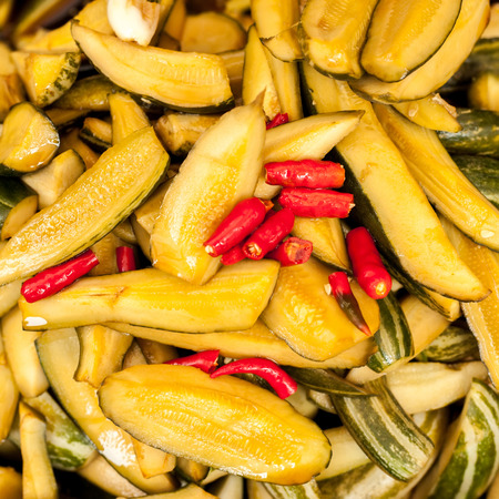 Preserved in traditional asian stile spicy vegetables for sale at marketの写真素材