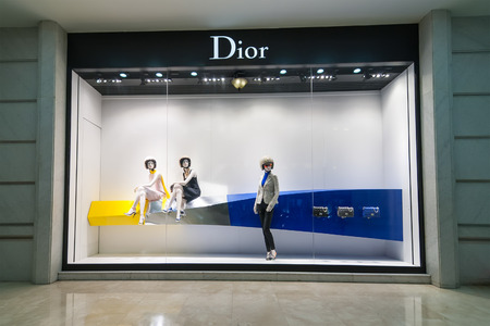 HO CHI MINH, VIETNAM - JAN 21, 2014: Christian Dior boutique display window with haute couture clothes and luxury accessories for exclusive shopping and in most attractive tourists city in Vietnamのeditorial素材