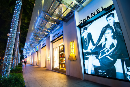 HO CHI MINH, VIETNAM- JAN 21, 2014: Chanel boutique display window with haute couture clothes and luxury accessories advertising for exclusive shopping and in most attractive tourists city in Vietnamのeditorial素材