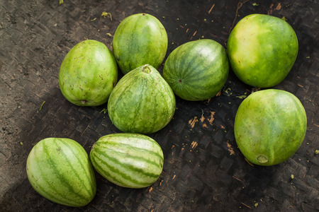 Organic oriental melons for sale at outdoor asian marketplace. Food backgroundの写真素材