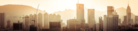 Hong Kong aerial cityscape panorama view with building construction near Victoria Harbor at sunset. Asia travel destinationsの写真素材