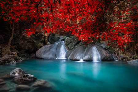 Jangle landscape with flowing turquoise water of Erawan cascade waterfall at deep tropical rain forest. National Park Kanchanaburi, Thailandの写真素材