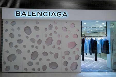HONG KONG - 22 JAN, 2015: Balenciaga fashion boutique display window with mannequin in luxury clothes and accessories for exclusive shopping. Founded in 1919 by Cristobal Balenciaga, Spanish designerのeditorial素材