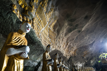 Amazing view of lot Buddhas statues and religious carving on limestone rock in sacred Sadan Sin Min cave. Hpa-An, Myanmar (Burma) travel landscapes and destinationsの写真素材