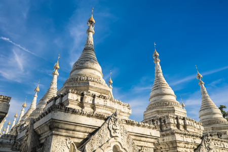 Sandamuni Pagoda with row of white pagodas. Amazing architecture of Buddhist Temples at Mandalay. Myanmar (Burma) travel landscapes and destinationsの写真素材