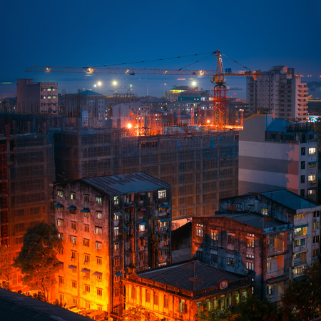 Sunset aerial view of Yangon cityscape with construction cranes. Myanmar (Burma) travel landscapes and destinationsの写真素材