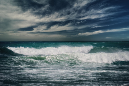 Stormy ocean landscape with rainy cloudsの写真素材