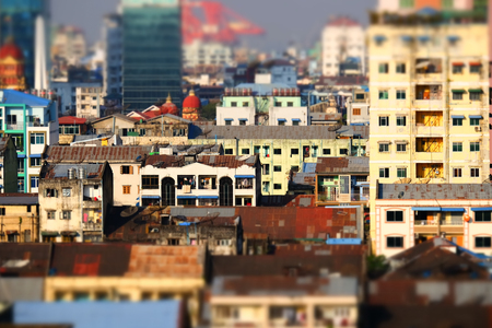 Tilt shift blur effect. Futuristic aerial view panorama of developing Yangon city. Myanmar (Burma)の写真素材