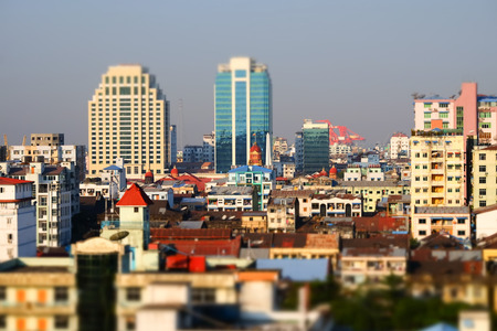 Tilt shift blur effect. Futuristic aerial view panorama of developing Yangon city. Myanmar (Burma)の写真素材