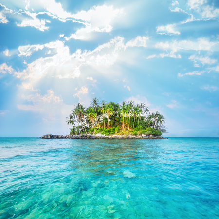 Ocean landscape with palm trees at tropical island under blue sky. Thailand travel landscapes and destinationsの写真素材