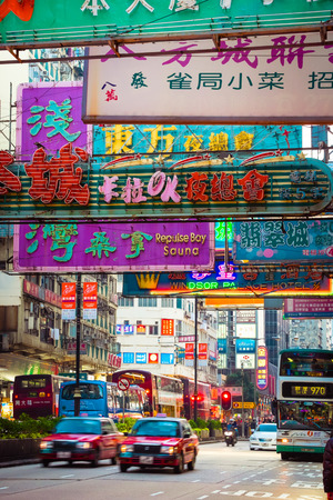 HONG KONG - JAN 18, 2015: Hong Kong cityscape view with city transport and plenty bright advertisements, billboards on skyscrapers facadesのeditorial素材