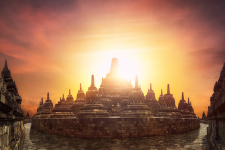 Amazing sunset at Borobudur Temple. World Buddhist heritage and great architecture of 9th century. Java island, Indonesiaの写真素材