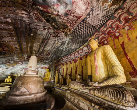 Amazing view of lot Buddhas statues and religious carving inside cave in sacred Golden Temple. Dambulla, Sri Lanka travel destinationsの写真素材