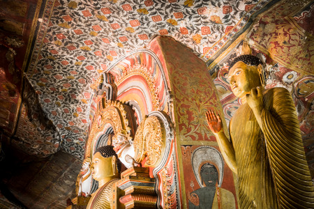 Amazing view of lot Buddhas statues and religious carving inside cave in sacred Golden Temple. Dambulla, Sri Lanka travel destinationsの写真素材