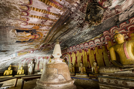 Amazing view of lot Buddhas statues and religious carving inside cave in sacred Golden Temple. Dambulla, Sri Lanka travel destinationsの写真素材