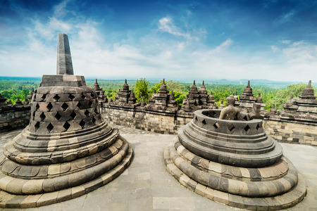 Amazing view of stone stupas at ancient Borobudur Buddhist temple against beautiful landscape on...