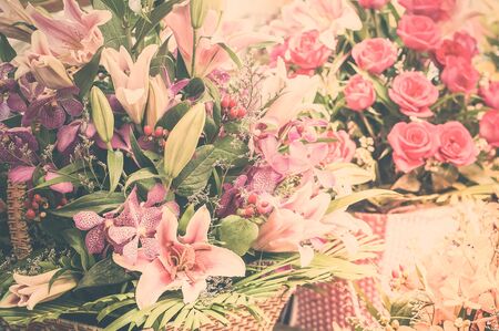 Beautiful different flowers bouquets at street shop. Floral composition in modern shabby chic styleの写真素材