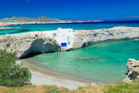 View of traditional fishing village with white houses on coastline. Turquoise water of Aegean sea Milos island. Amazing mediterranean landscape. Greeceの写真素材