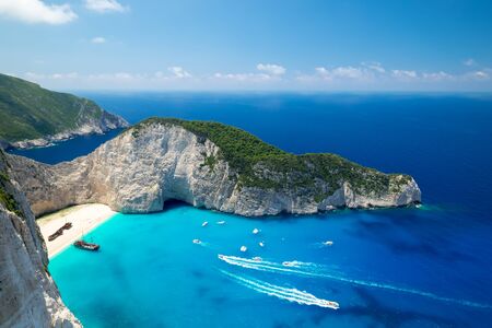 Picturesque top view of Navagio Beach or Shipwreck Beach. Old ship after crash on sand in lagoon...