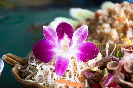 Orchid flower on foodの写真素材
