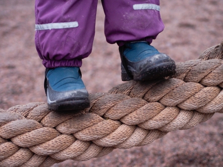 Child on a Rope on a Playgroundの写真素材