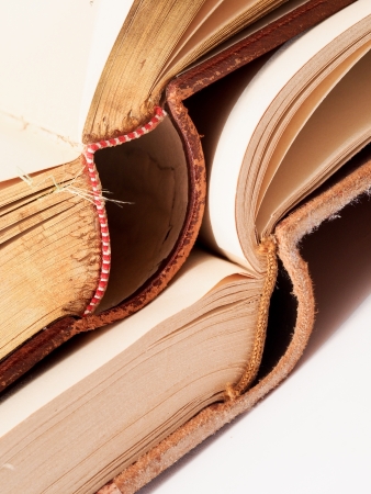 two old open books on a white の写真素材