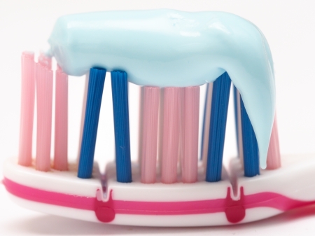 closeup of a toothbrush with toothpaste